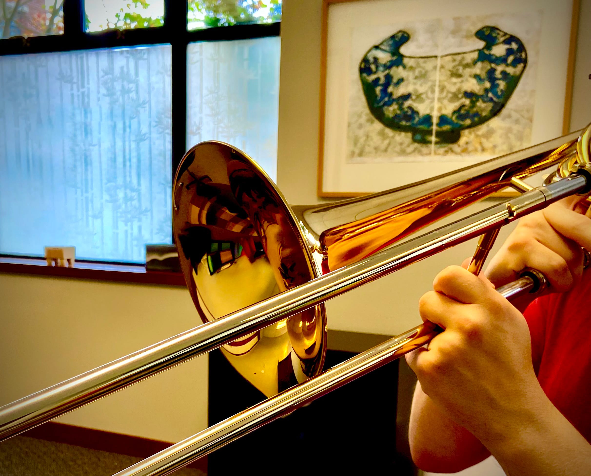 Close-up of a trombone player’s hands while performing